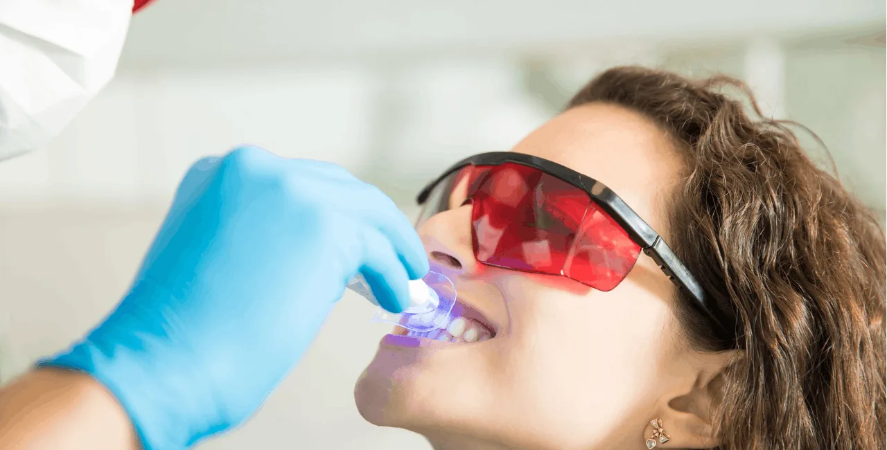 female patient getting her teeth whiten