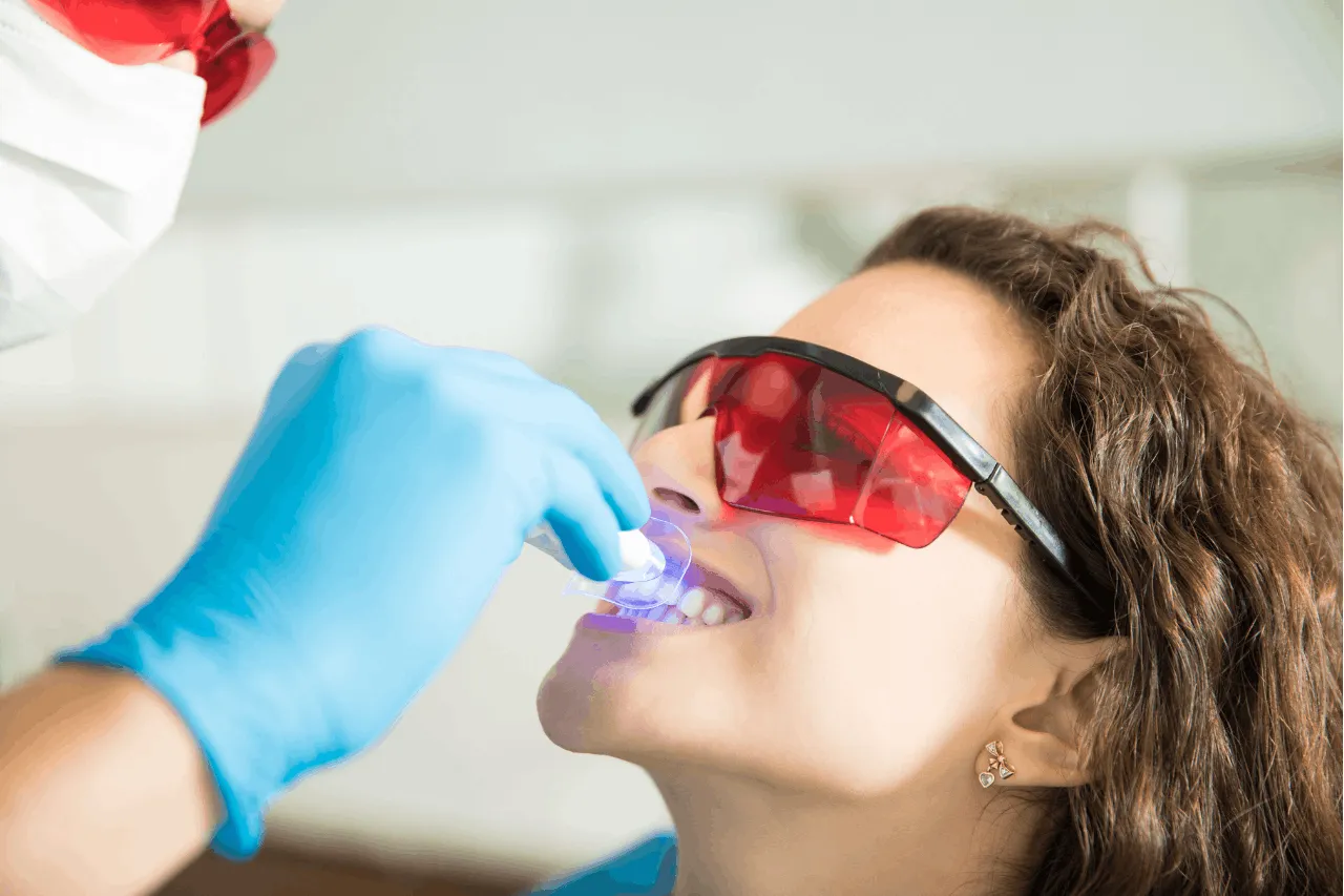 female patient getting her teeth whiten