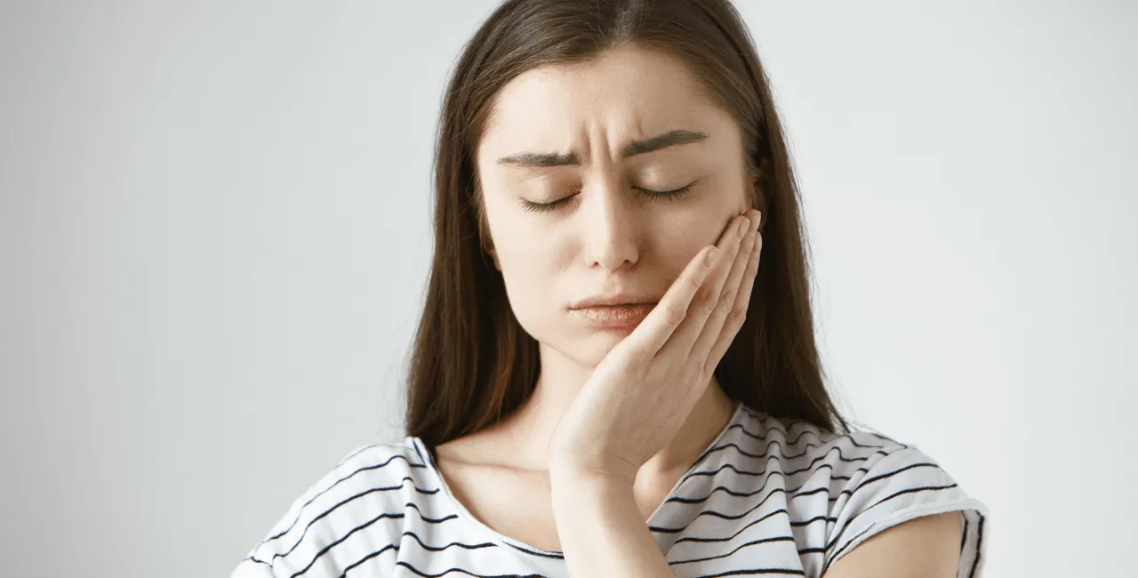 female with toothache