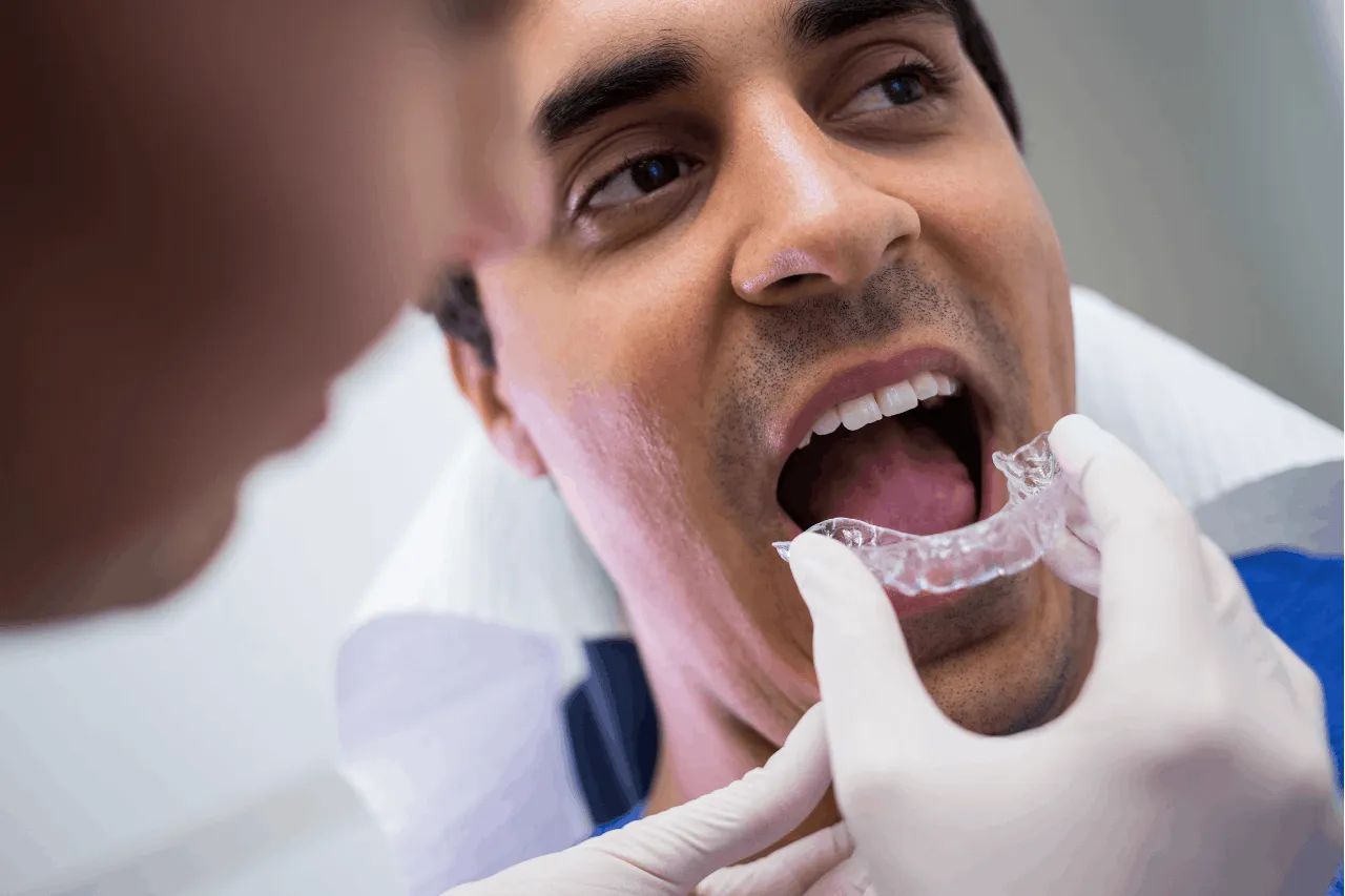 man putting on retainers