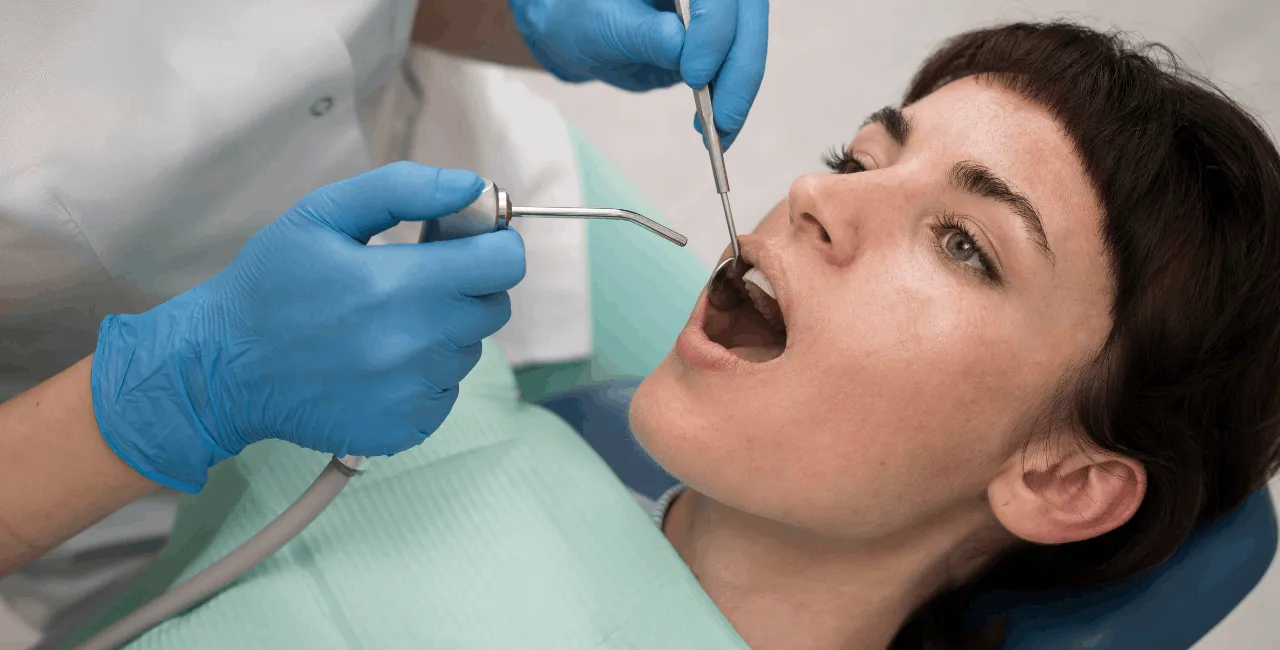 woman scaling her teeth