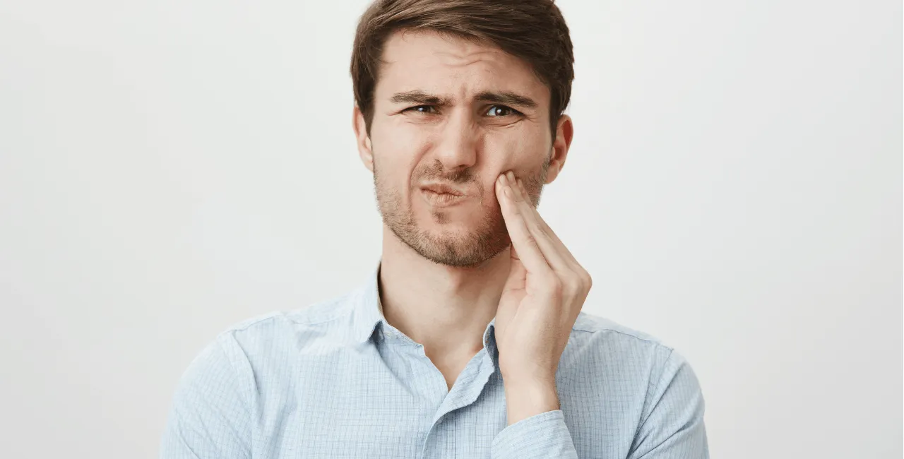man with toothache